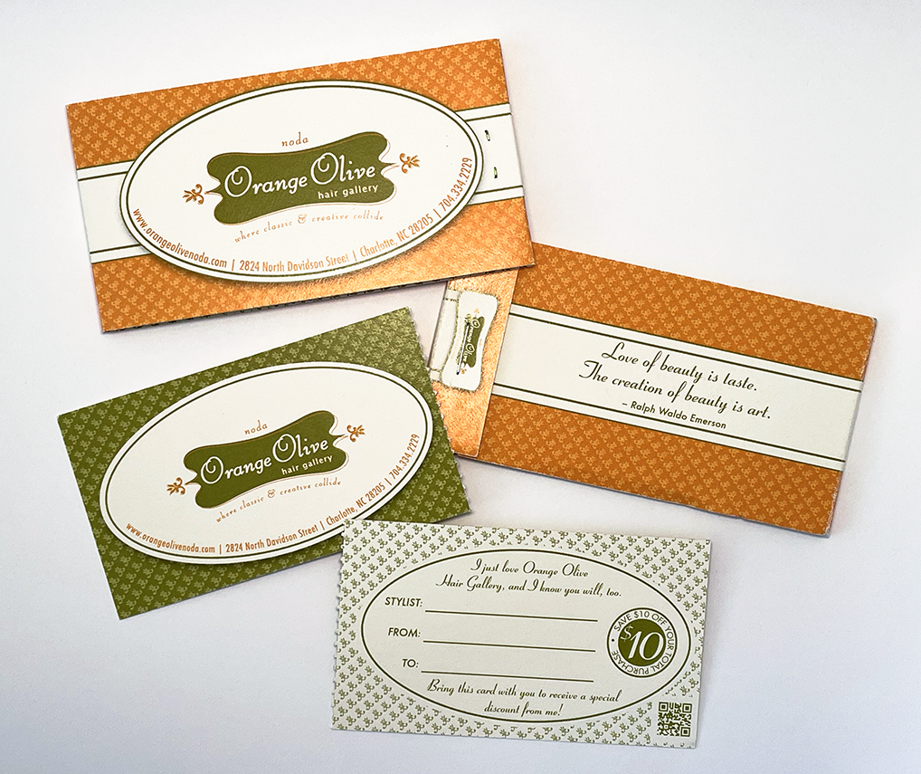 A perforated referral card printed on high quality paper stock with mostly green ink to resemble money.