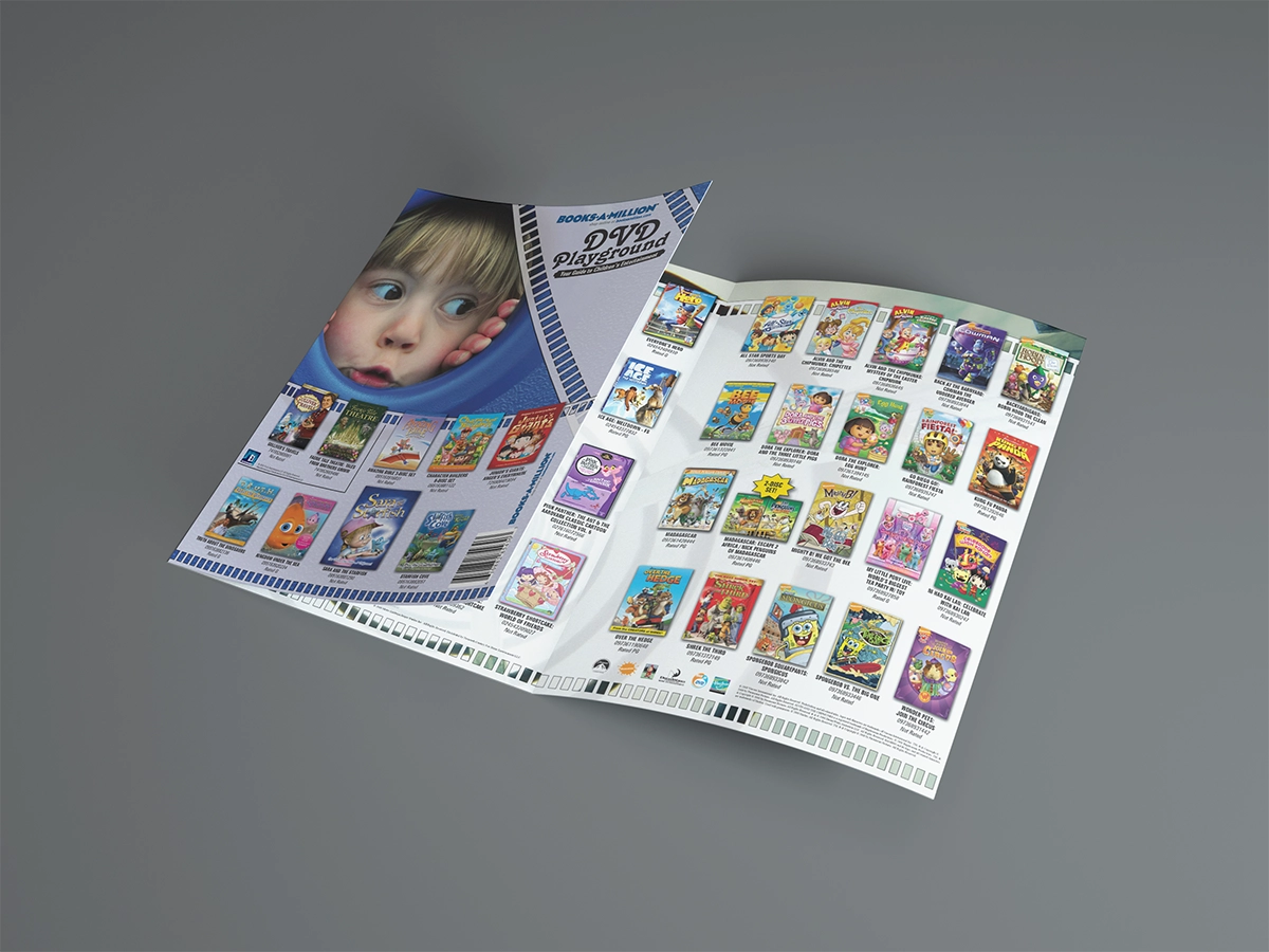A mockup of a trifold catalog featuring titles for kids. The cover shows a child looking through a ubmarine-style portal on a playground toy, and the other panels feature playground imagery including sidewalk chalk and swings.